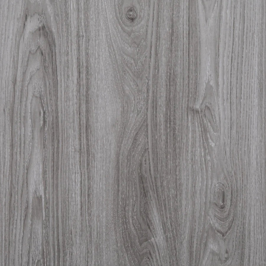 Close-up of gray wood grain wall tiles with vertical striations.