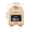 Wooden pregnancy announcement photo frame with a baby silhouette and the text Coming Soon
