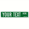 A rectangular green sign with white text that reads YOUR TEXT HERE on a white background.
