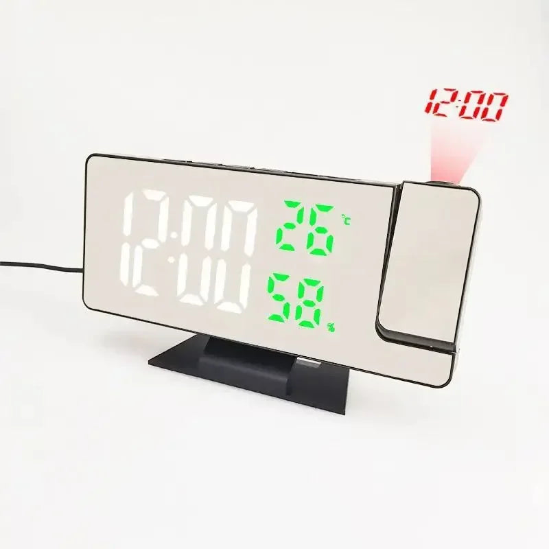A digital projection alarm clock displaying 12:00 and 26 degrees Celsius on a white background.