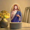 Illuminated Jesus Christ night light featuring a painted figure of Jesus with long hair and beard.
