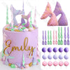 A purple mermaid cake decorated with various sea creature toppers, including fish tails and seashells.