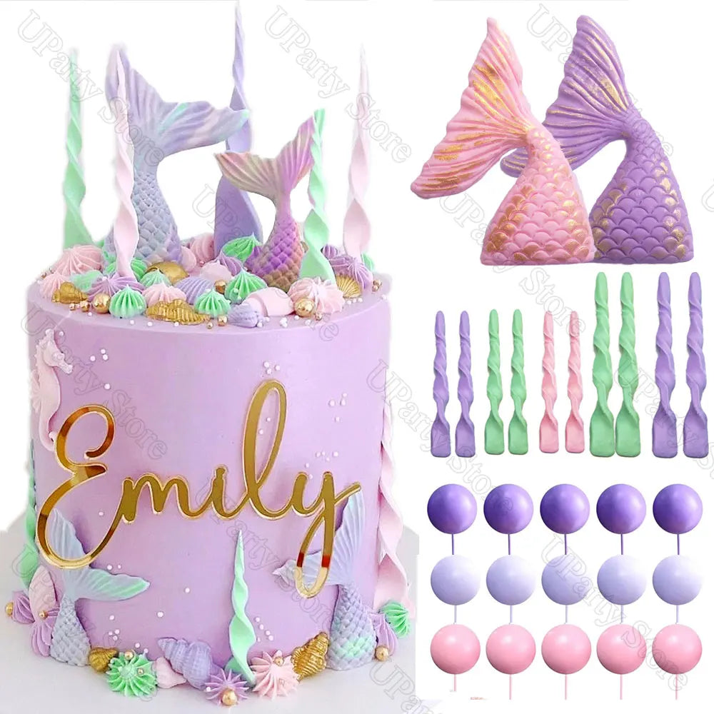 A purple mermaid cake decorated with various sea creature toppers, including fish tails and seashells.