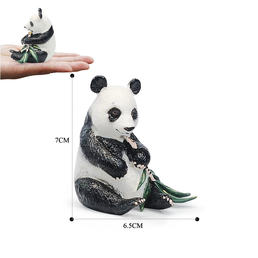 A realistic panda figurine set showing a panda in a seated pose with green leaves.