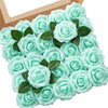 A bouquet of light blue foam roses with green leaves displayed in a cardboard box.