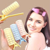 A woman holds several heat-free curling irons in various colors and styles for DIY hair curling.