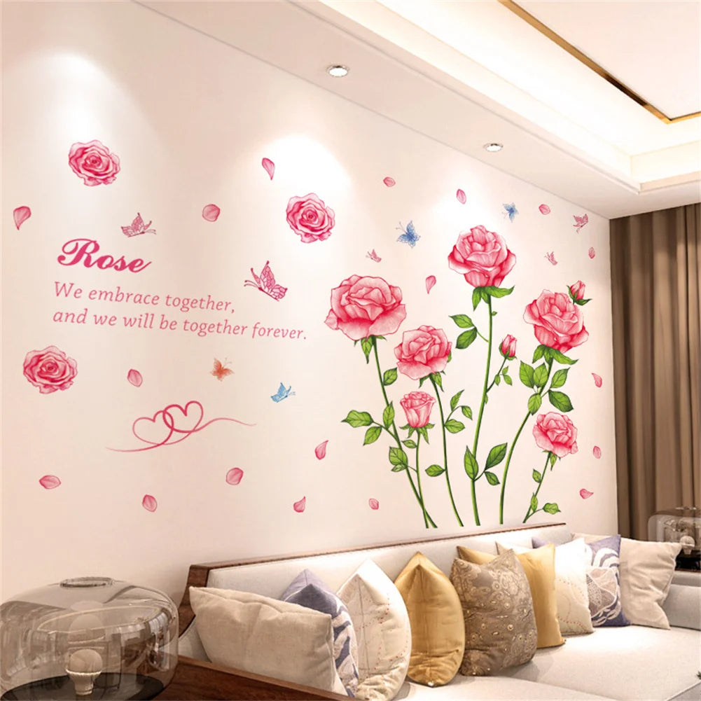 Wall stickers featuring pink and red roses and butterflies on a white wall.