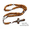 A wooden bead rosary cross necklace featuring natural wood beads and a silver crucifix.
