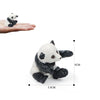 A realistic panda figurine showing a black and white panda in a sitting pose.
