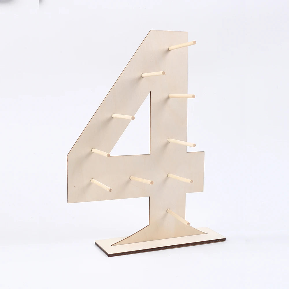 A wooden number display stand shaped like the numeral four, used for serving desserts.