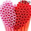 A close-up view of 150 heart-shaped pink disposable straws in a red container.