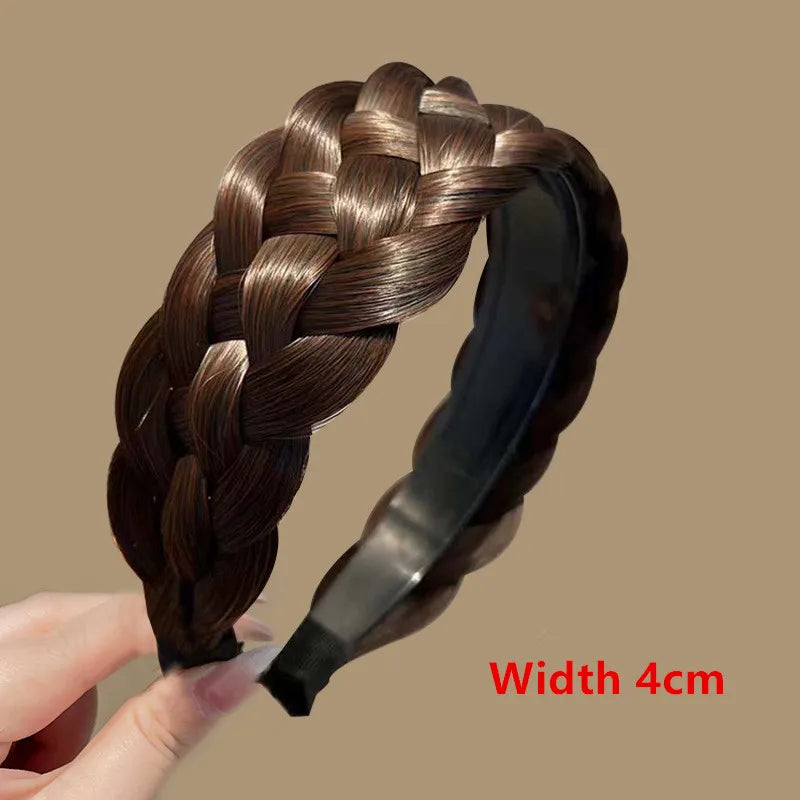 A dark brown braided hair band is shown being held by a hand, highlighting its texture and width.