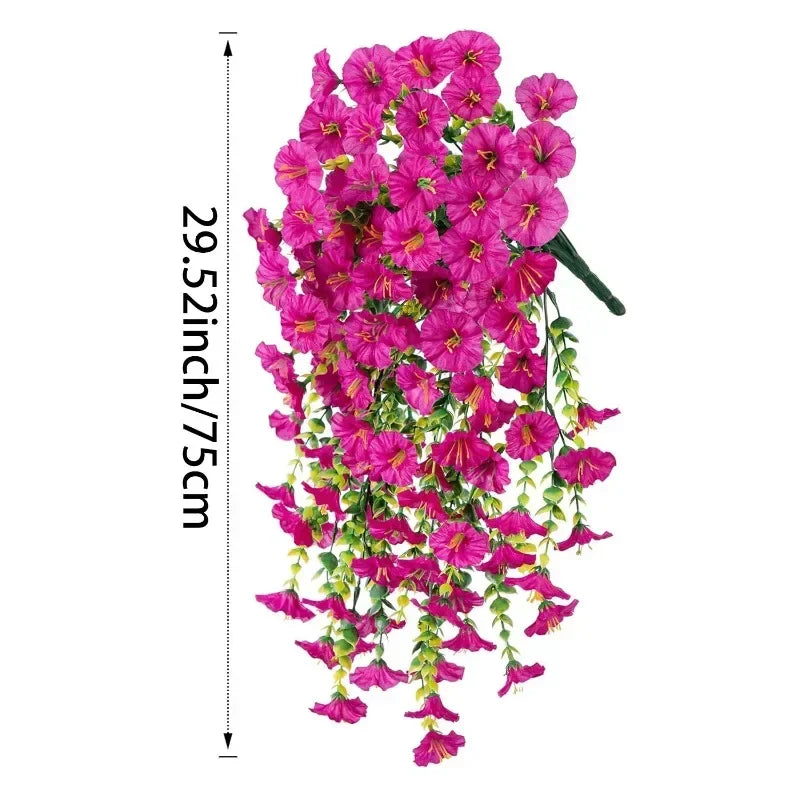 A vibrant pink artificial morning glory garland cascading downwards.
