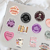 A collection of creative romantic reading stickers on a laptop, featuring themes like dark romance, book club, and enemies to