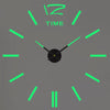 A gray analog clock face with bright green hands and markers, showing the time.