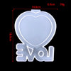 White heart-shaped silicone mold with the letters VOI visible on the bottom