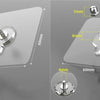 A set of strong adhesive wall hooks with various sizes and mounting options shown on a gray surface.