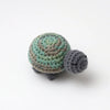Handmade crocheted turtle plush with mottled green and gray scales.