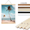 A set of five natural teak wood magnetic poster frames in various shades displayed next to a tropical landscape photo.