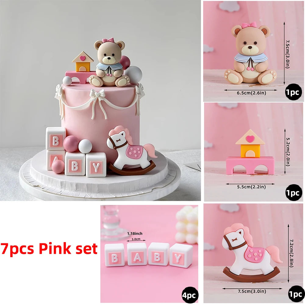 A pink cake decorated with bear and car block toppers, including a bear and a white horse design.
