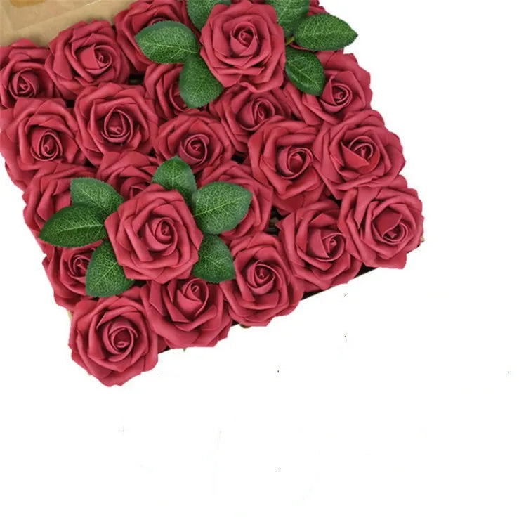 A dense arrangement of deep red foam rose artificial flowers for weddings and home decor.