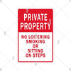 Red warning sign with white text stating Private Property and prohibiting loitering, smoking, or sitting on steps.