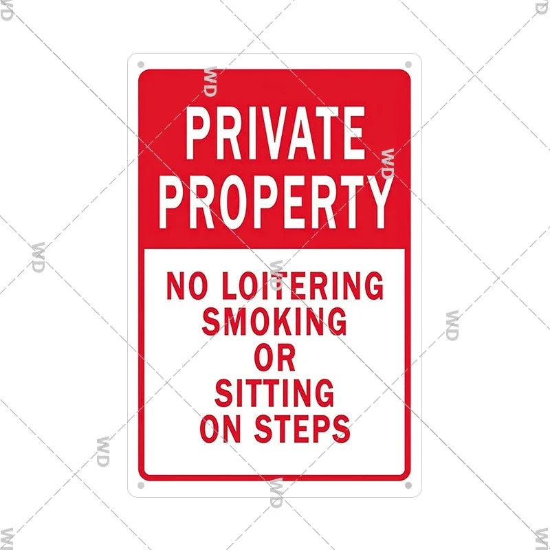 Red warning sign with white text stating Private Property and prohibiting loitering, smoking, or sitting on steps.