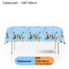 Blue tablecloth featuring a happy birthday design with colorful animals and balloons