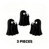 Three black glow-in-the-dark ghost figurines with playful poses