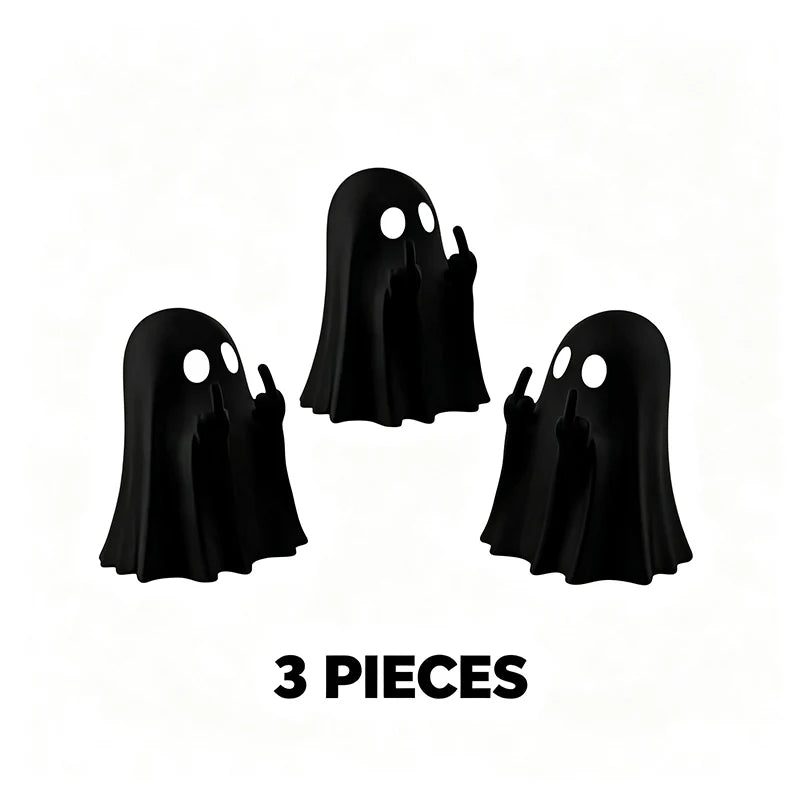 Three black glow-in-the-dark ghost figurines with playful poses