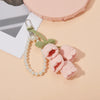 Handmade crocheted pink and green flower keyring charm with pearl beads