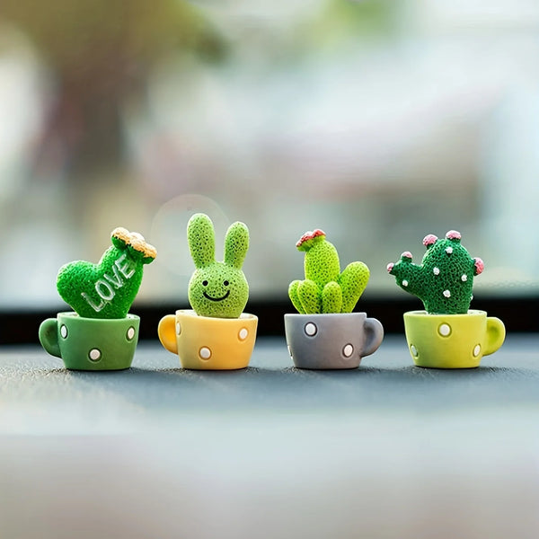 A set of four resin succulent cacti in various shades of green and yellow sitting in small cups for home decor.