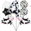 A set of cow print number balloons including a large letter 'O' and several spherical balloons.