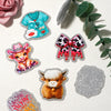 Silver glitter acrylic charms including a pink rose, a blue nurse shirt, a leopard print bow, and a golden calf charm.