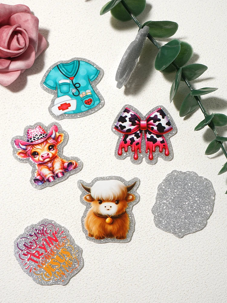 Silver glitter acrylic charms including a pink rose, a blue nurse shirt, a leopard print bow, and a golden calf charm.