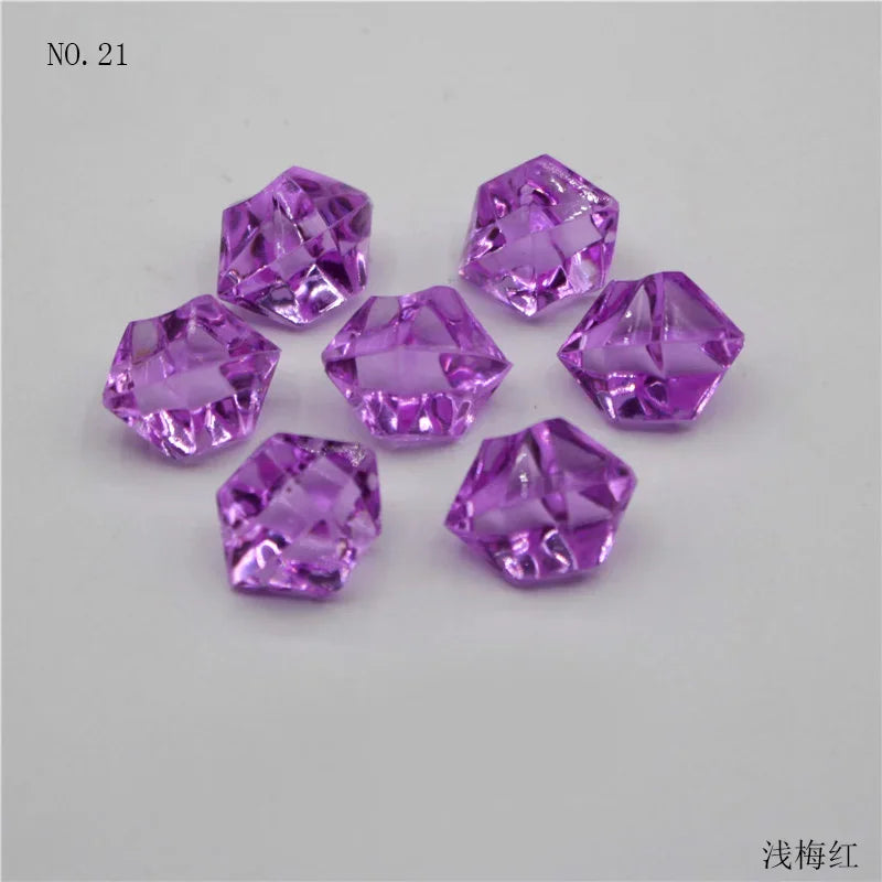 A collection of purple crystal ice cube acrylic stones, cut into various geometric shapes, displayed on a white background.