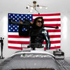 A black leather jacket wearing a patriotic American flag tapestry as a background for a bedroom scene.