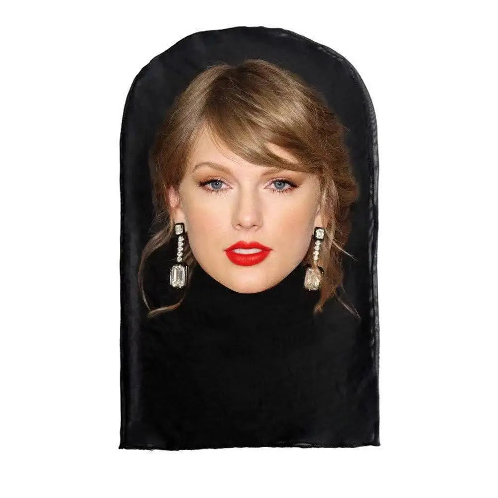 A woman wearing a black velvet mask with blonde hair and earrings.