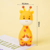 A yellow elephant cake topper featuring a cute face and large ears, shown against a light background.