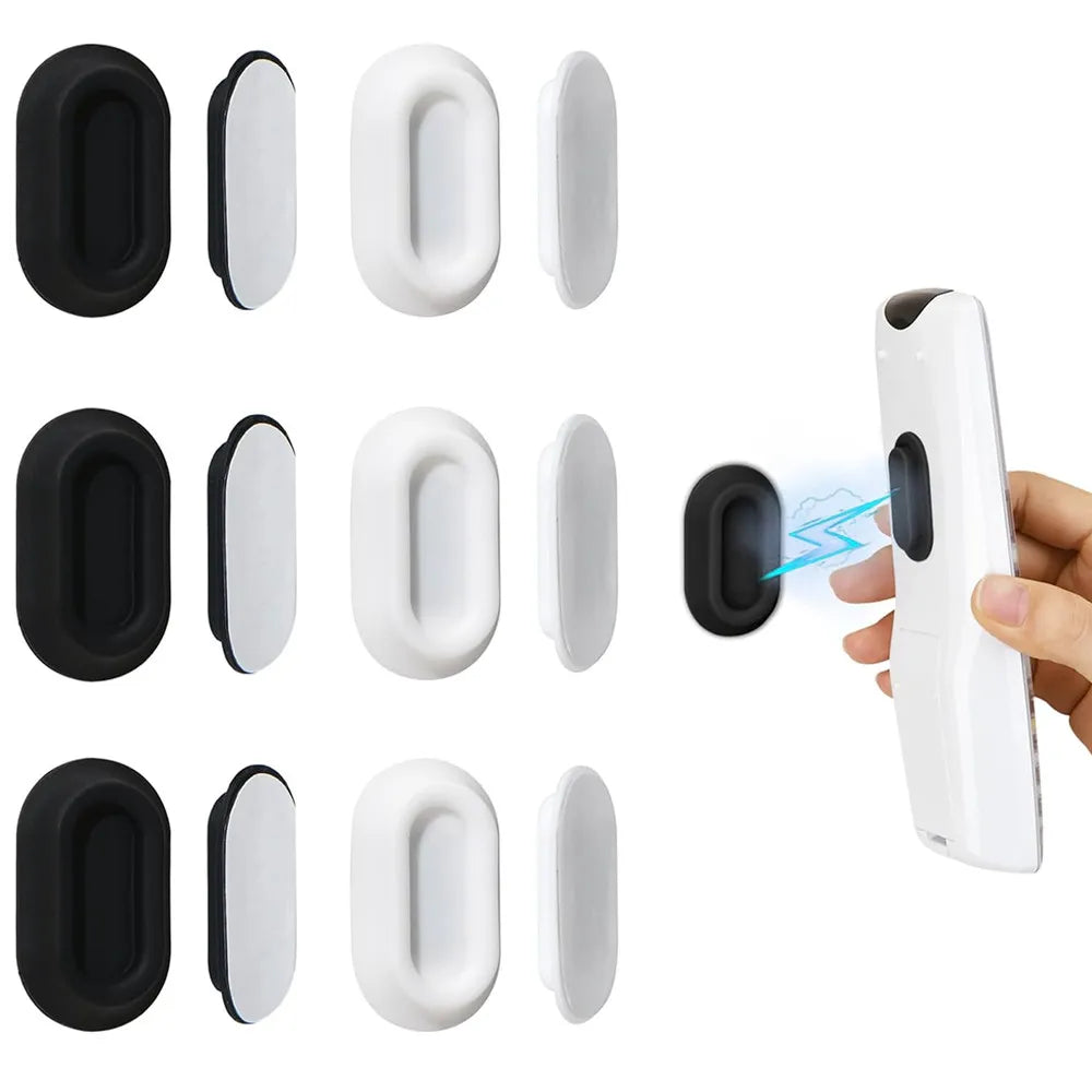 A set of black and white magnetic silicone remote control holders shown in various shapes and orientations.