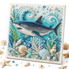Diamond painting featuring a gray and blue shark surrounded by various sea life and pearls