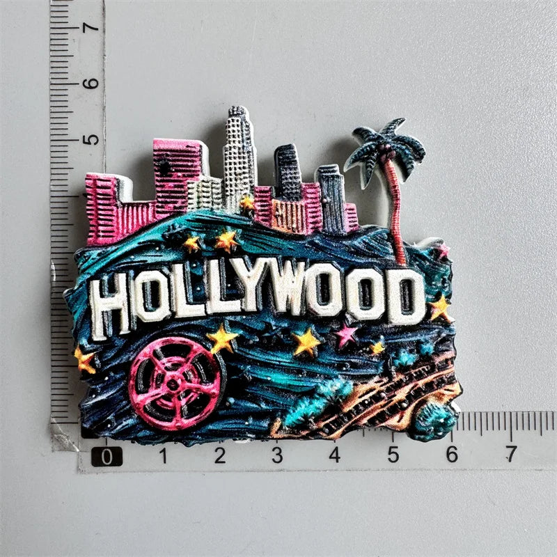 A set of colorful fridge magnets depicting the Hollywood sign and city skyline.