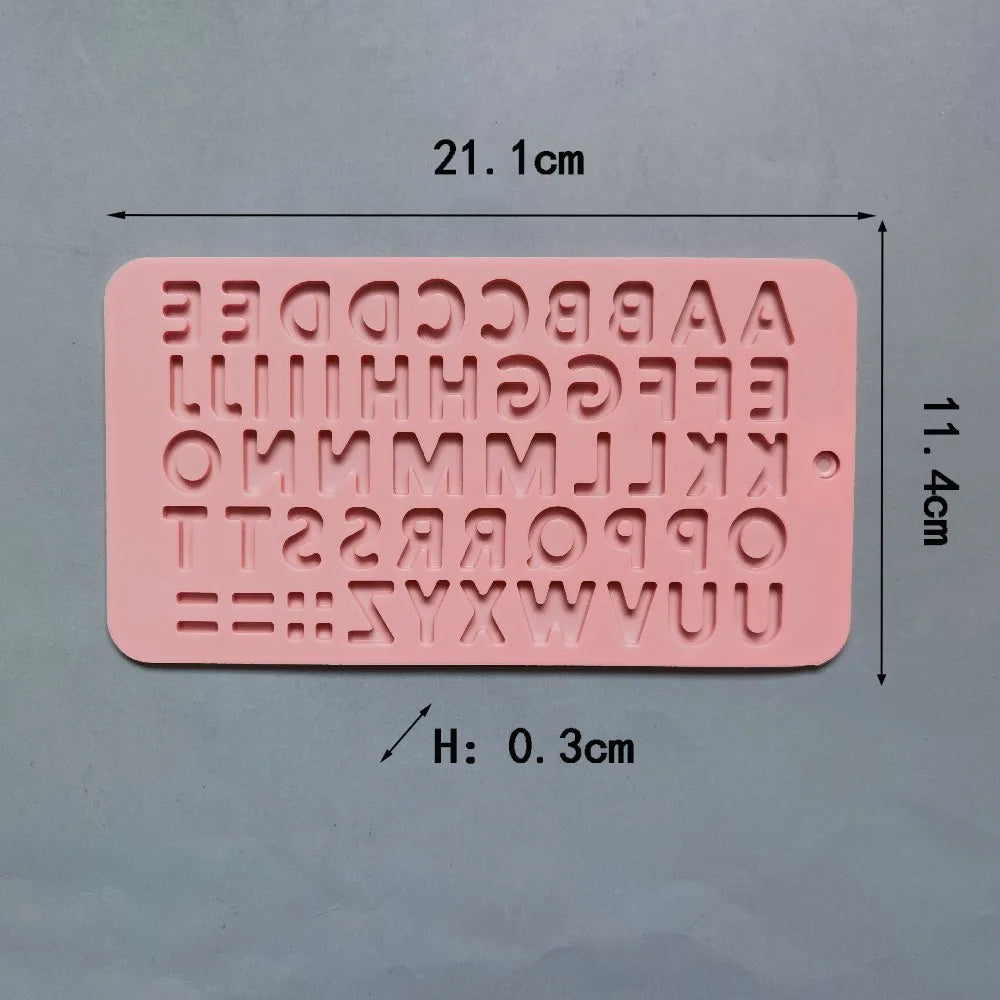 A pink silicone mold set featuring various uppercase letters and numbers for baking