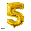 A shiny gold latex balloon shaped like the number 5 for party decorations.
