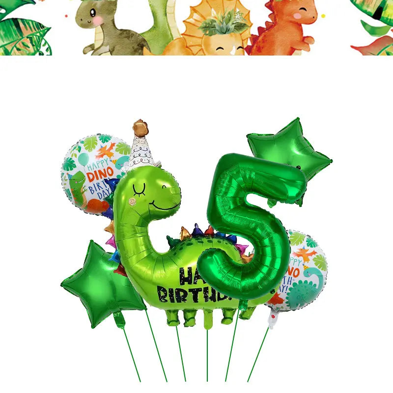 Green dinosaur shaped balloon banner and cake topper for a birthday party