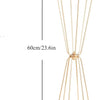 A tall, slender gold geometric flower stand with a tapered design.