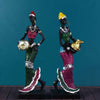 Hand-painted resin statue of an African tribal lady with gold jewelry and colorful traditional attire.