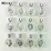 A collection of decorative glass bottles, each containing a silver-colored figurine and topped with a twist cap.