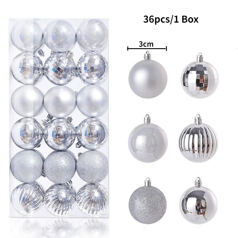 A box containing 36 silver and clear glass Christmas tree ornament balls.