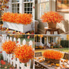Two vibrant orange artificial fall eucalyptus and flower stems used for outdoor decor